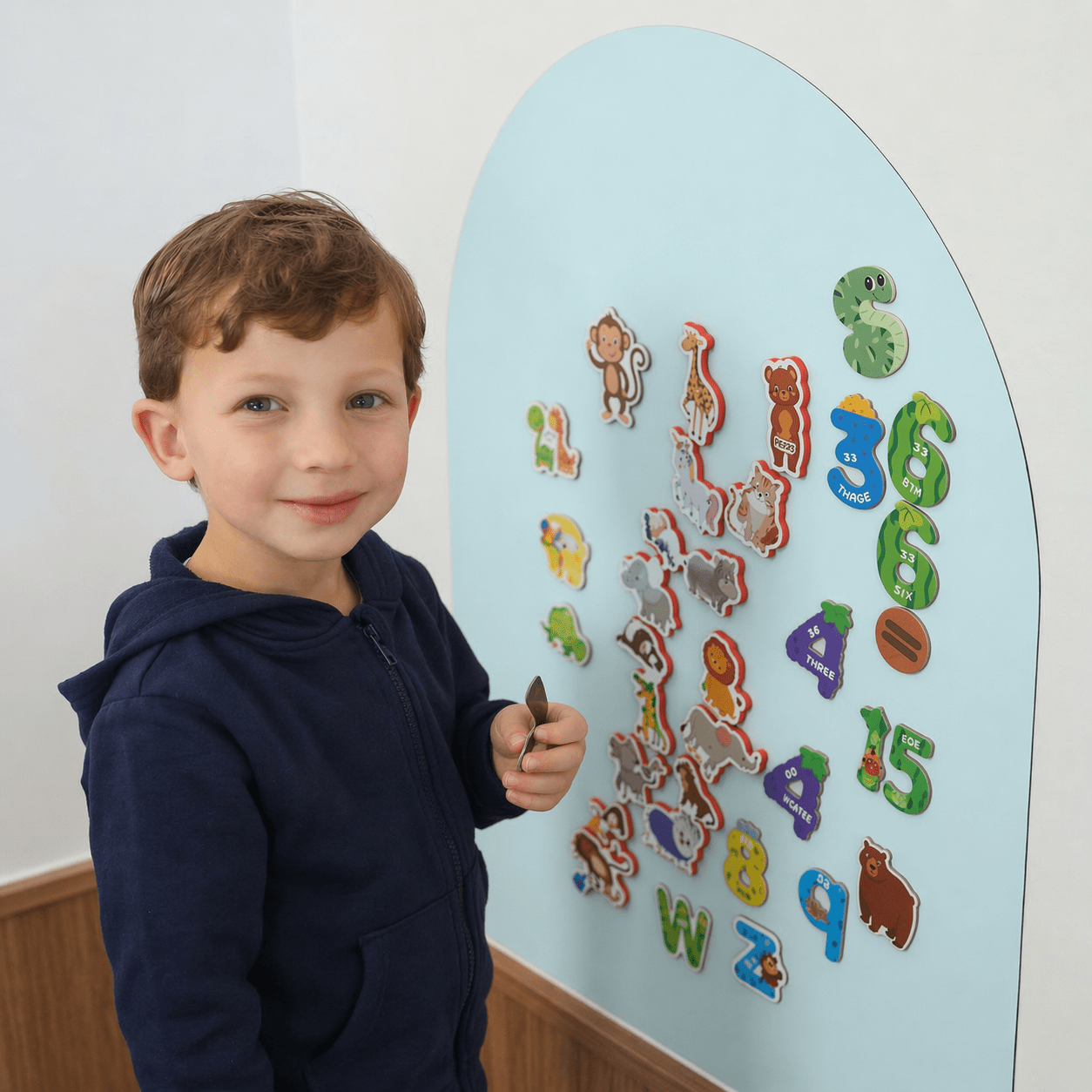 Child playing with a Little Joey magnetic wall
